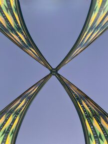 “Energetic” sculpture by artist Blessing Hancock in Fort Worth’s Sycamore Park — a colorful, figure-eight-shaped metal artwork with curving forms and community-inspired text bands, fabricated and installed by Gizmo Art Production.